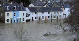 Flood claims two lives in UK 